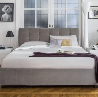 Letto con testiera trapuntata e contenitore Monterey di Calligaris