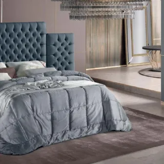 Letto dal design elegante con imponente testiera in tessuto trapuntato Tosca di Stilfar